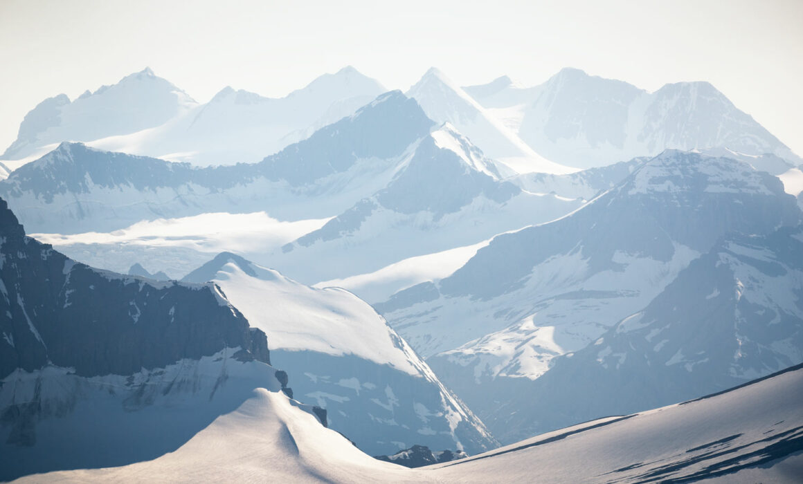 The Canadian Rocky Mountains standing tall with its glaciated summits punctuated by the Freshfield Group at the back photographed by Nick Fitzhardinge.