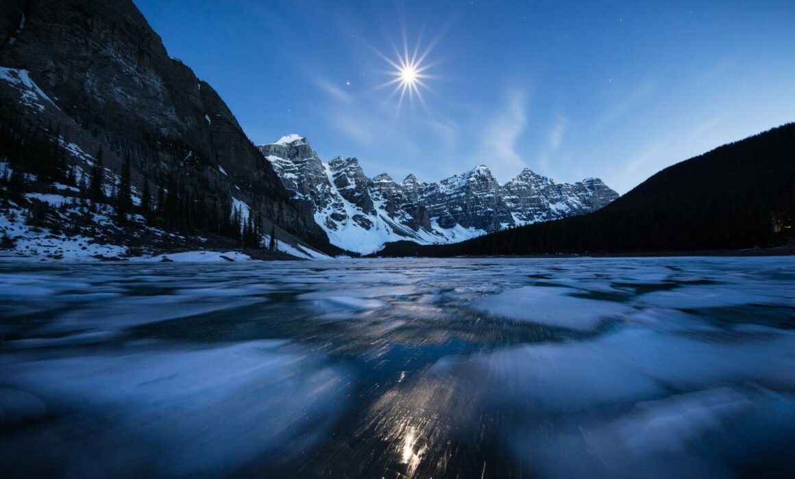 A moonstar and moving ice at Moraine Lake in the Valley of The Ten Peaks photographed by Nick Fitzhardinge.