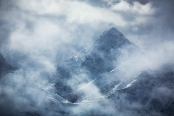 Mt Nestor appears through layers of mist and light photographed by Nick Fitzhardinge.